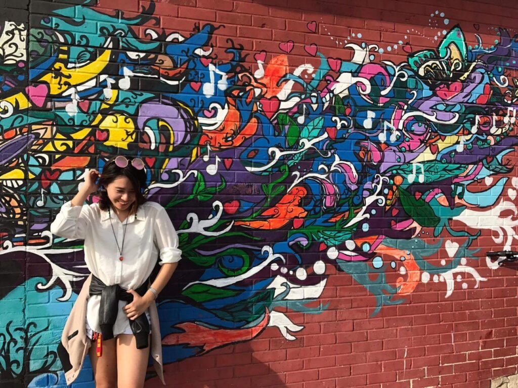 Me Posing Against an Art Wall